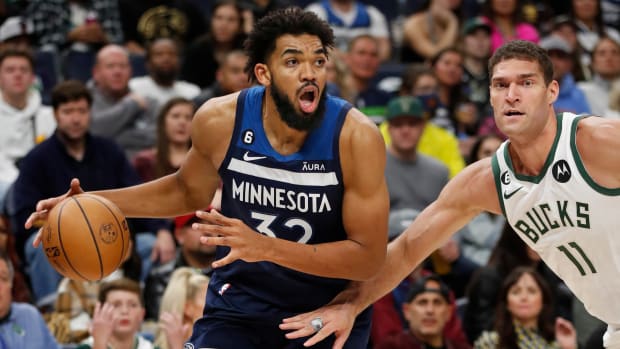 Karl-Anthony Towns dribbles to the rim.